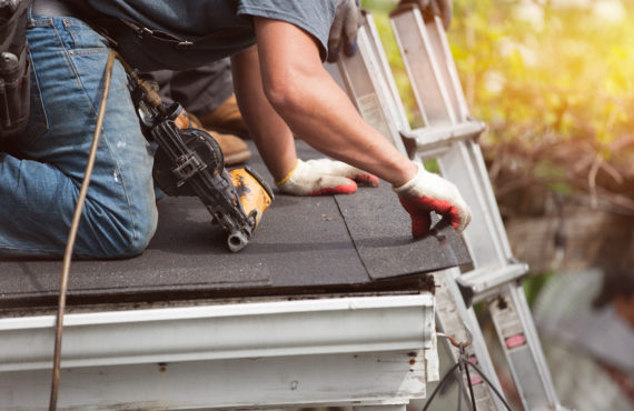 roofers installing new roof on house